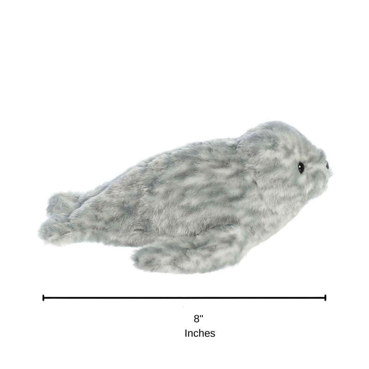 Side profile view of the Harbor Seal plush resting on its tummy with a measurement graphic indicating it is 8 inches long.
