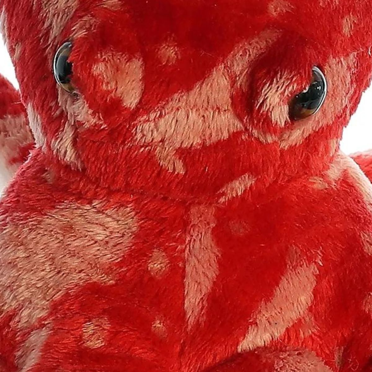 Close-up detail of the octopus's head highlighting the soft, textured red and tan fabric.