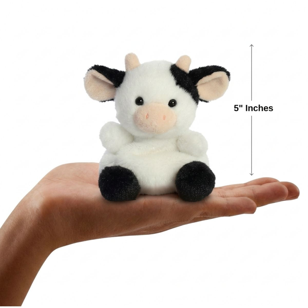 Dimension graphic showing the 5-inch Aurora Palm Pals Sweetie Cow resting comfortably in a person's hand.