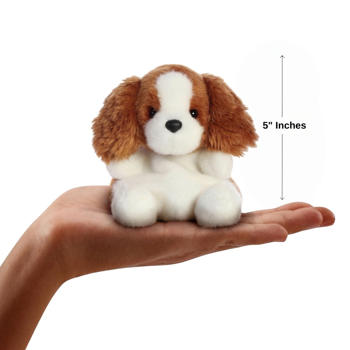 The miniature Lady Spaniel plush sitting balanced in an open human hand under a 5-inch height graphic indicator.