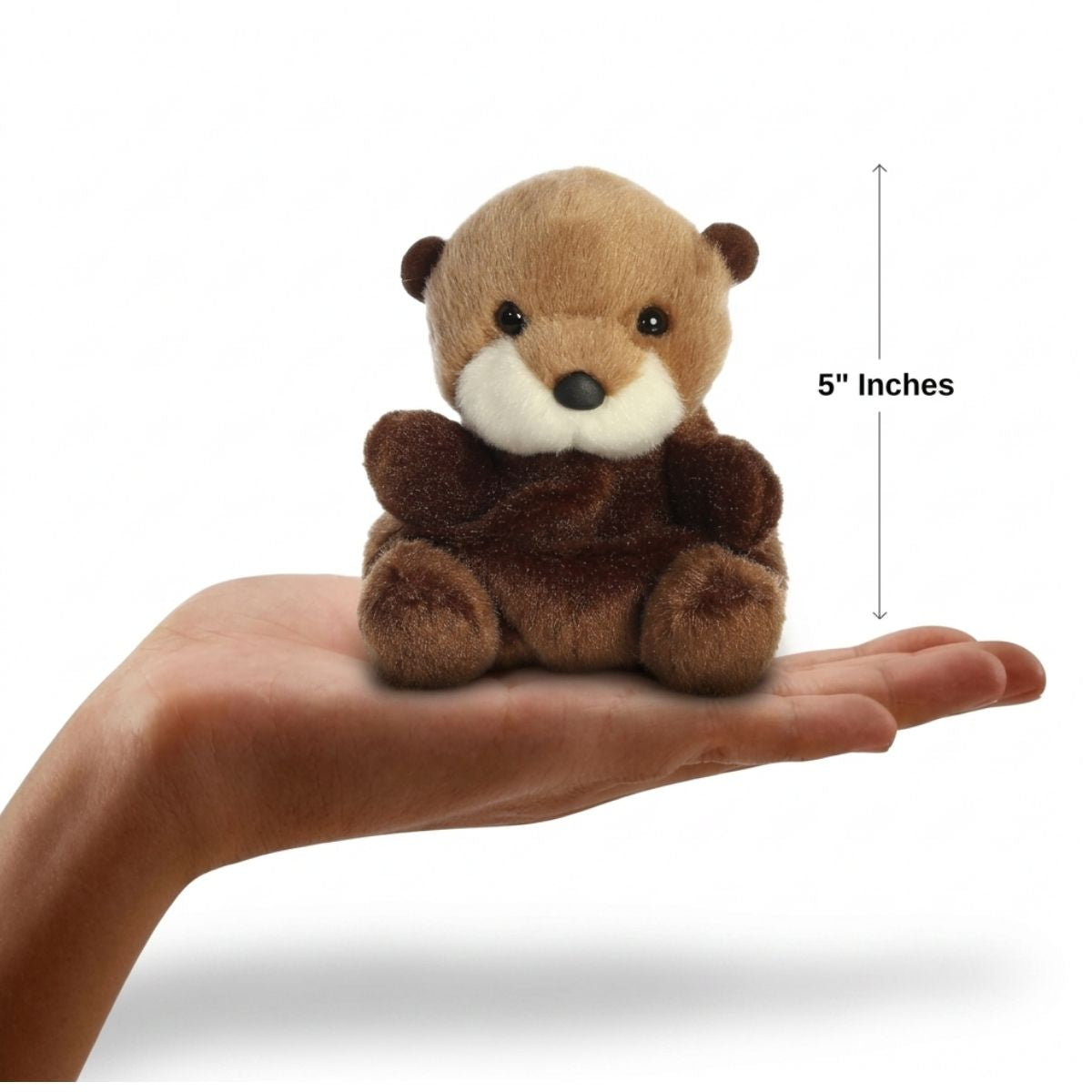 The miniature Selena Sea Otter plush sitting balanced in an open human hand under a 5-inch height graphic indicator.