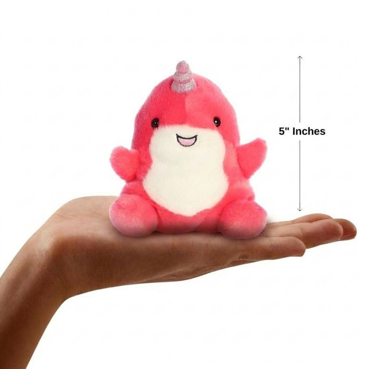 The miniature Nia Narwhal plush sitting balanced in an open human hand under a 5-inch height graphic indicator.