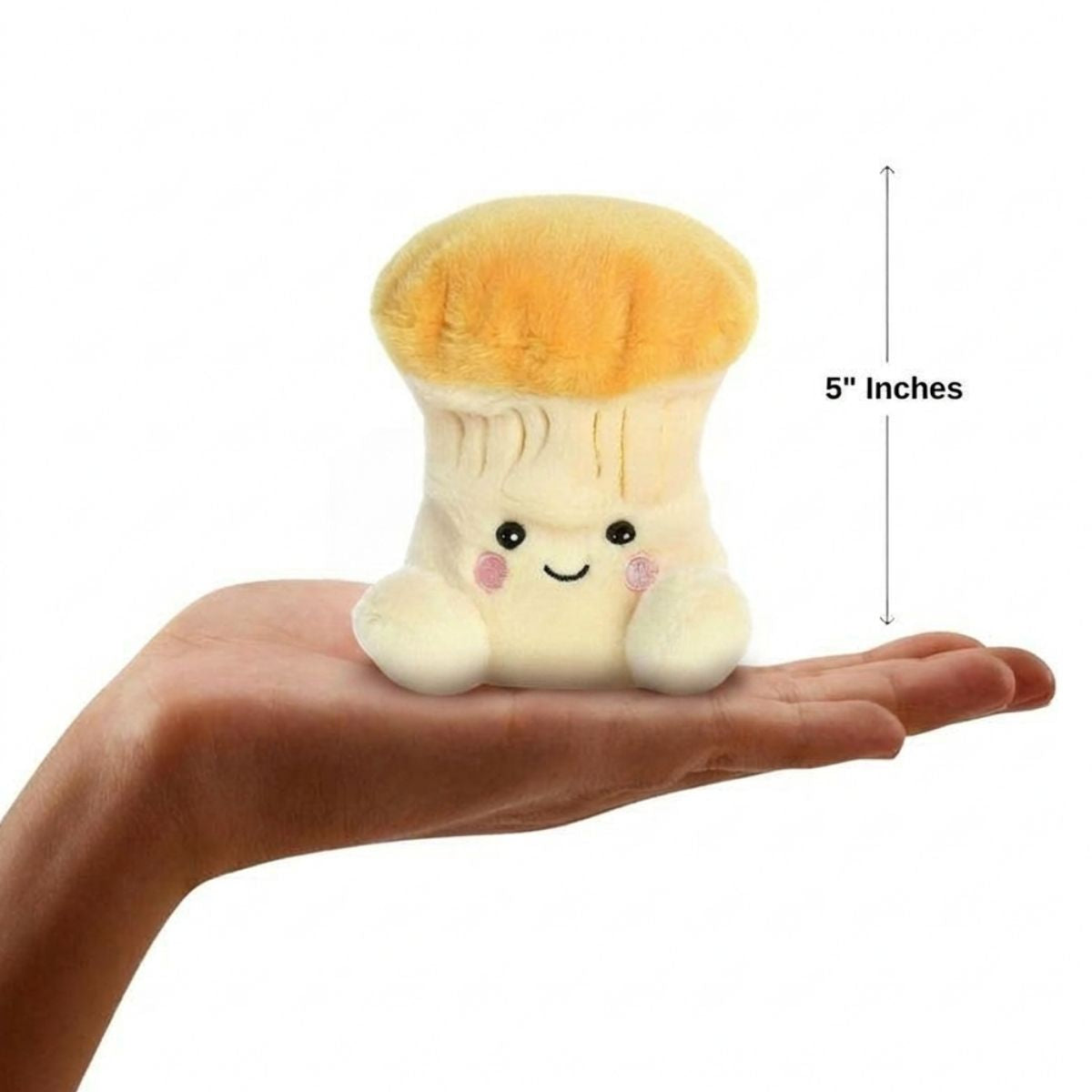 The miniature Jackie Chanterelle Mushroom plush sitting balanced in an open human hand under a 5-inch height graphic indicator.