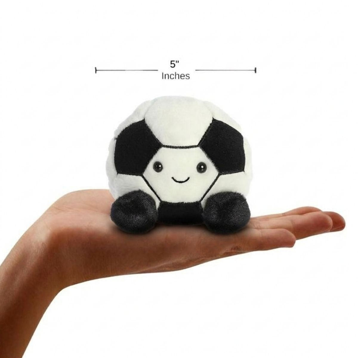 Sizing graphic for the Aurora Palm Pals Striker Soccer Ball plush showing it sitting perfectly in the palm of a hand, indicating a total height of 5 inches.