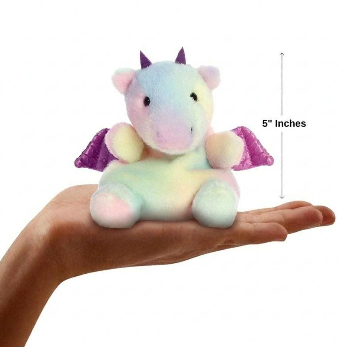 The miniature Aster Dragon plush sitting balanced in an open human hand under a 5-inch height graphic indicator.