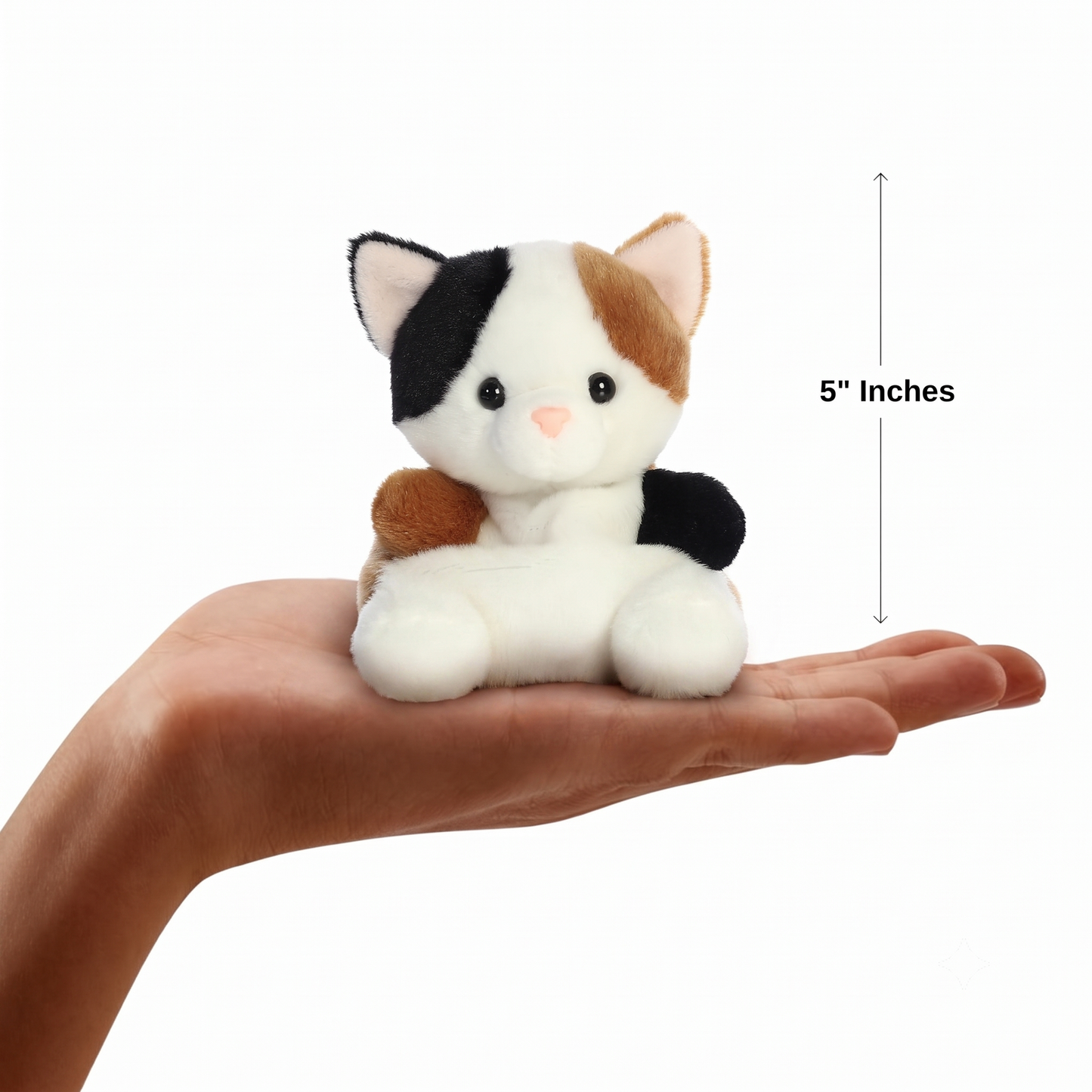 The miniature Peebs Calico Cat plush sitting balanced in an open human hand under a 5-inch height graphic indicator.