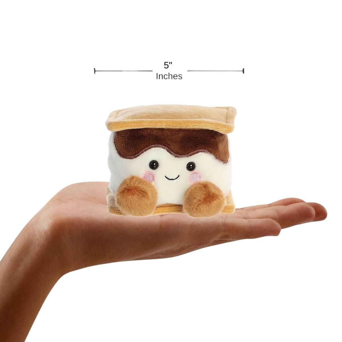 Sizing graphic for the Aurora Palm Pals Toastee S'more plush showing it sitting perfectly in the palm of a hand, indicating a total height of 5 inches.