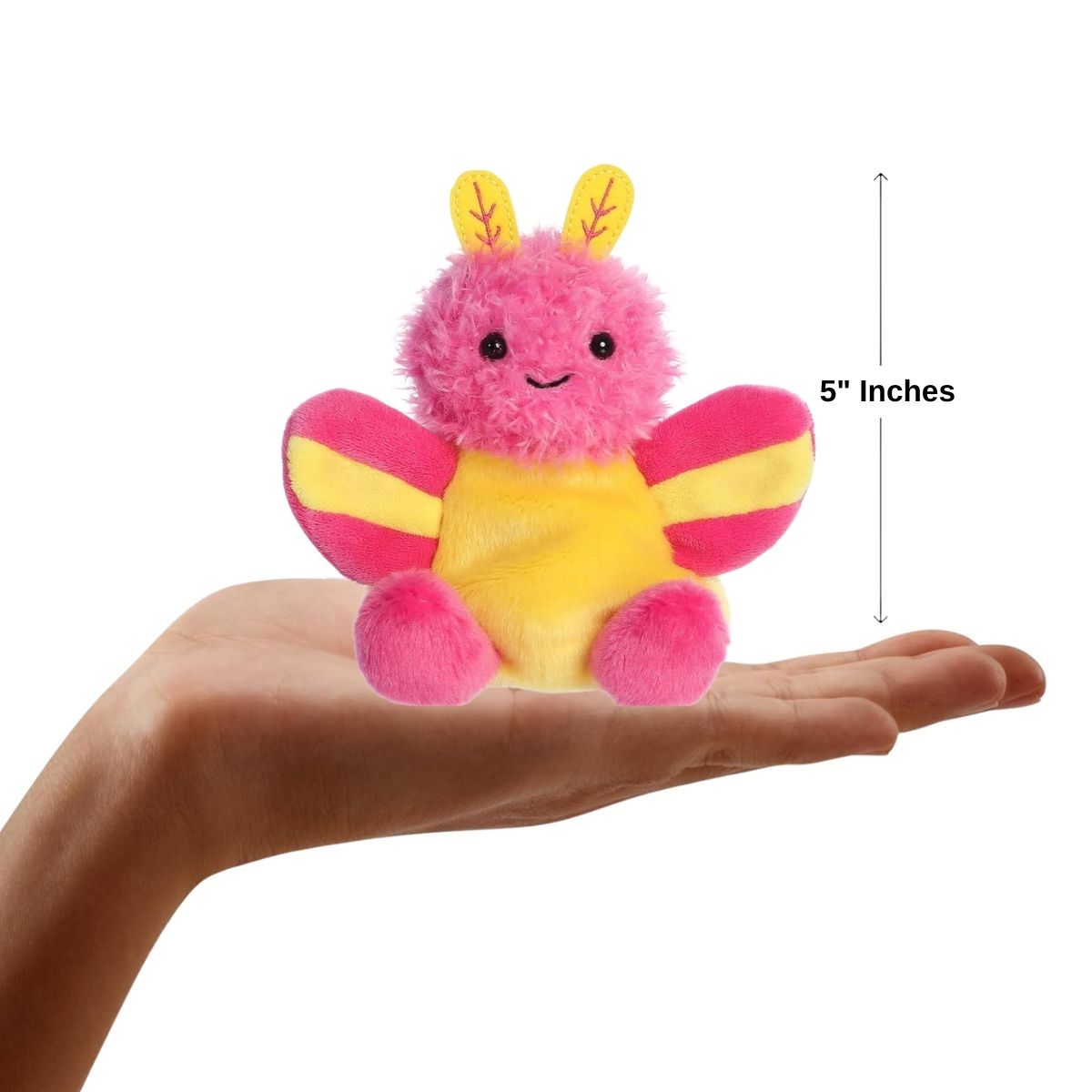 The miniature Astrid Rosy Maple Moth plush resting in an open human hand displaying a 5-inch width graphic indicator.