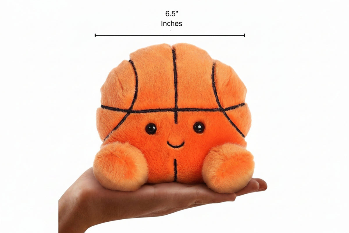 The enlarged 6.5-inch Hoops Basketball plush sitting balanced in an open human hand under an 8-inch height graphic indicator.
