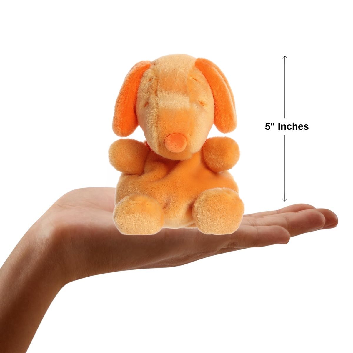 Sizing graphic showing the 5-inch Palm Pals Orange Snoopy plush sitting perfectly in the palm of a hand to demonstrate its small scale.