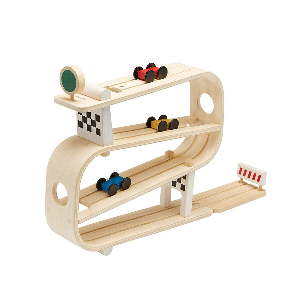 Angled view of the durable, earth-friendly PlanToys toddler car track showcasing its curved multi-level design.