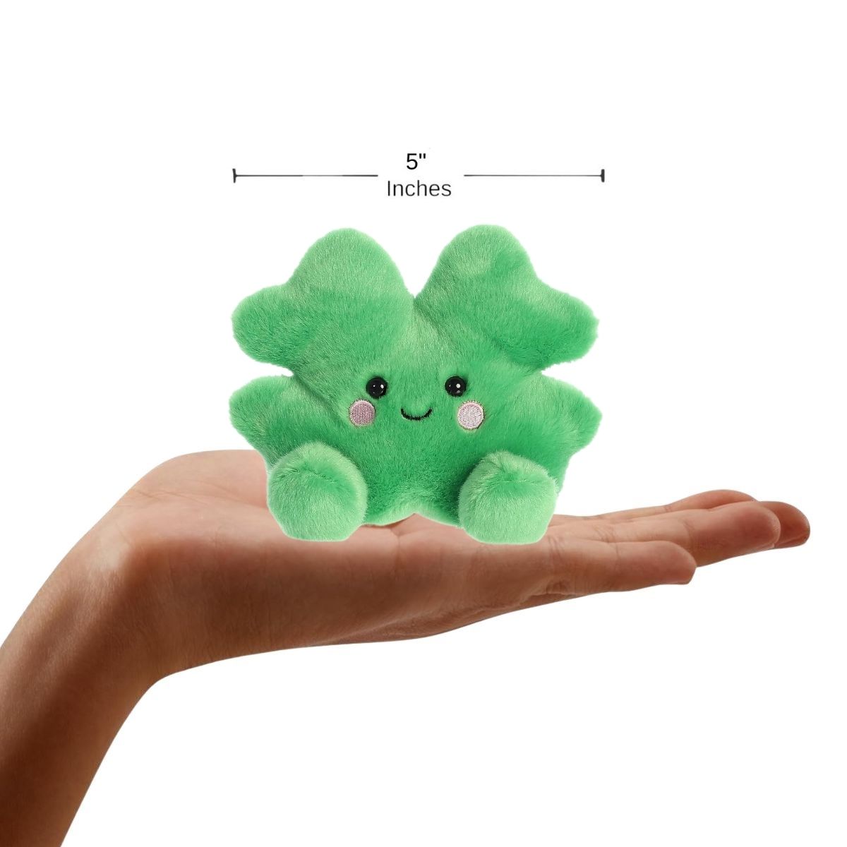 Hand holding the Chance Clover plush to demonstrate its palm-sized scale, with a measurement graphic indicating it is 5 inches wide.