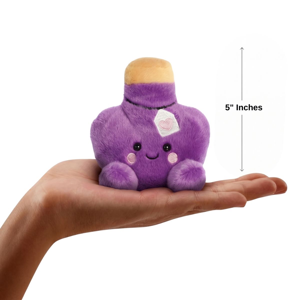 The miniature Naya Love Potion plush sitting balanced in an open human hand under a 5-inch height graphic indicator.
