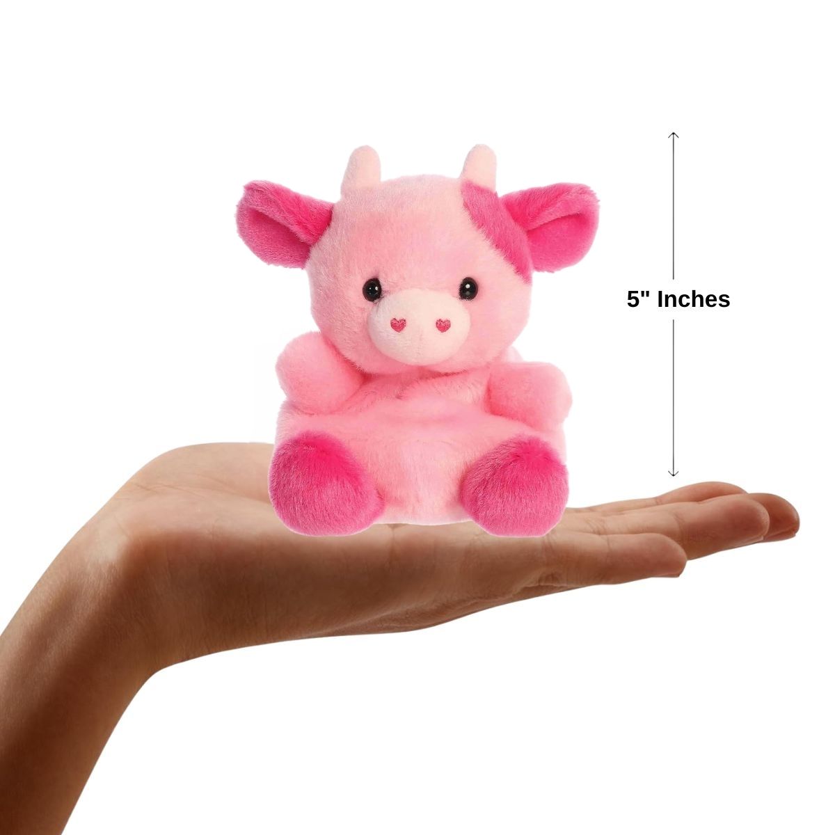 Sizing graphic showing the 5-inch Palm Pals Blossom Pink Cow plush sitting perfectly in the palm of a hand to demonstrate its small scale.