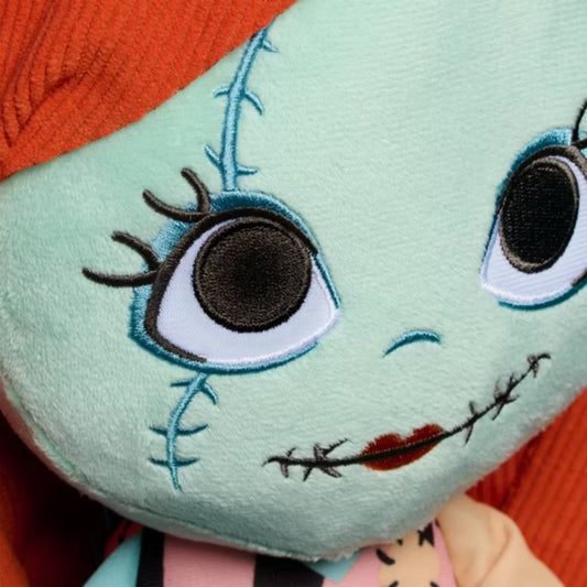Close-up view of Disney Sally 7-inch mini plush face showing big embroidered eyes and stitches.