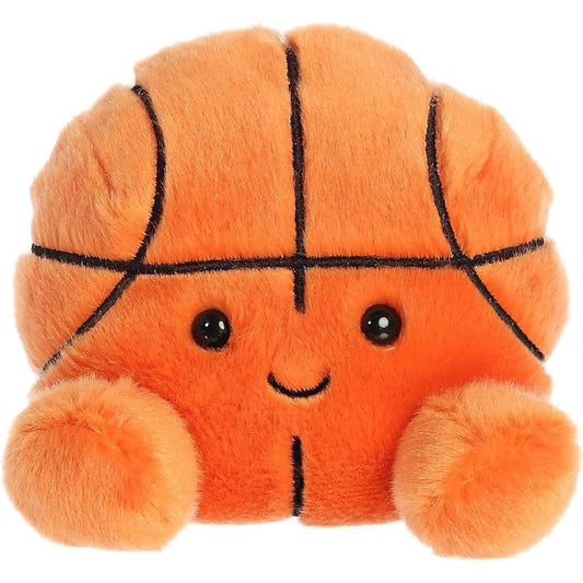 Front view of the adorable Aurora Hoops Basketball stuffed animal featuring a sweet smile, dark eyes, and classic black basketball seam details.