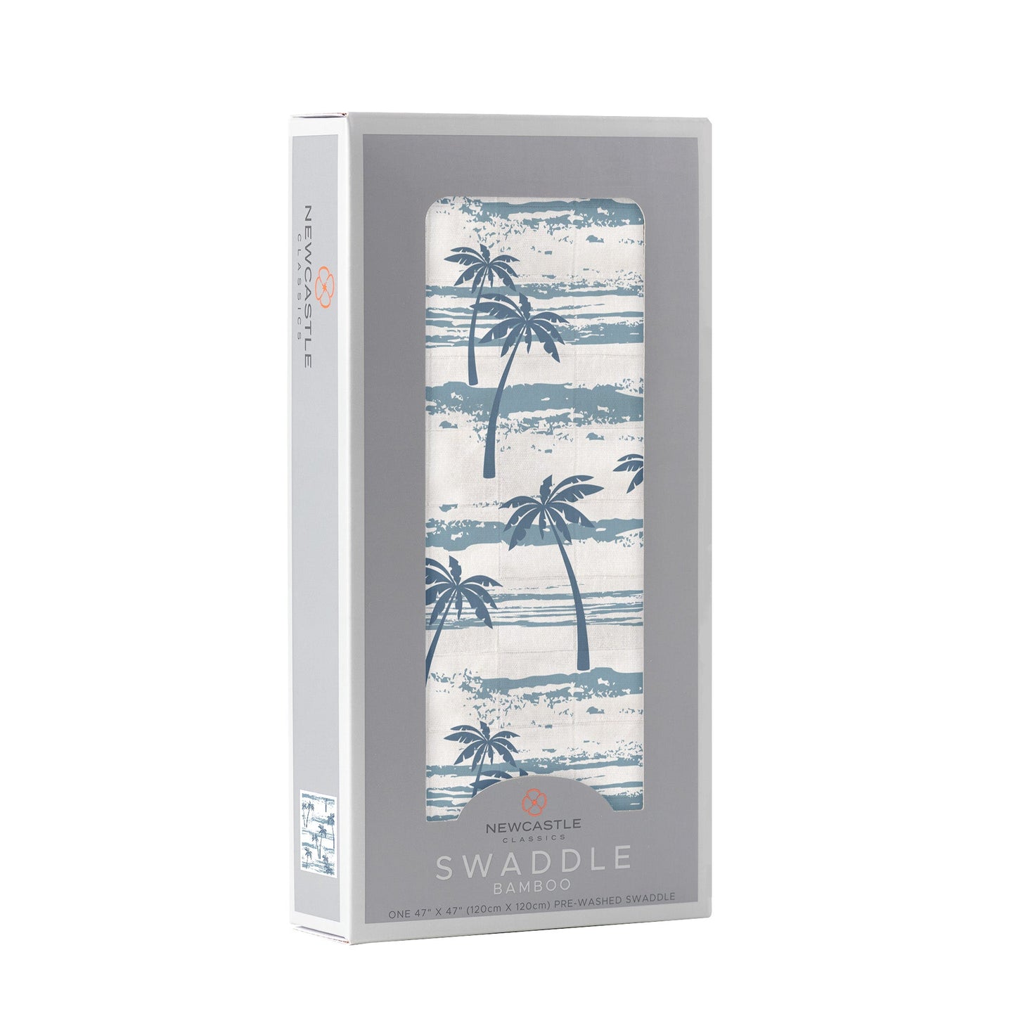 Angled front view of the packaged Ocean Palm Trees baby swaddle blanket folded inside a light grey Newcastle Classics window display box.