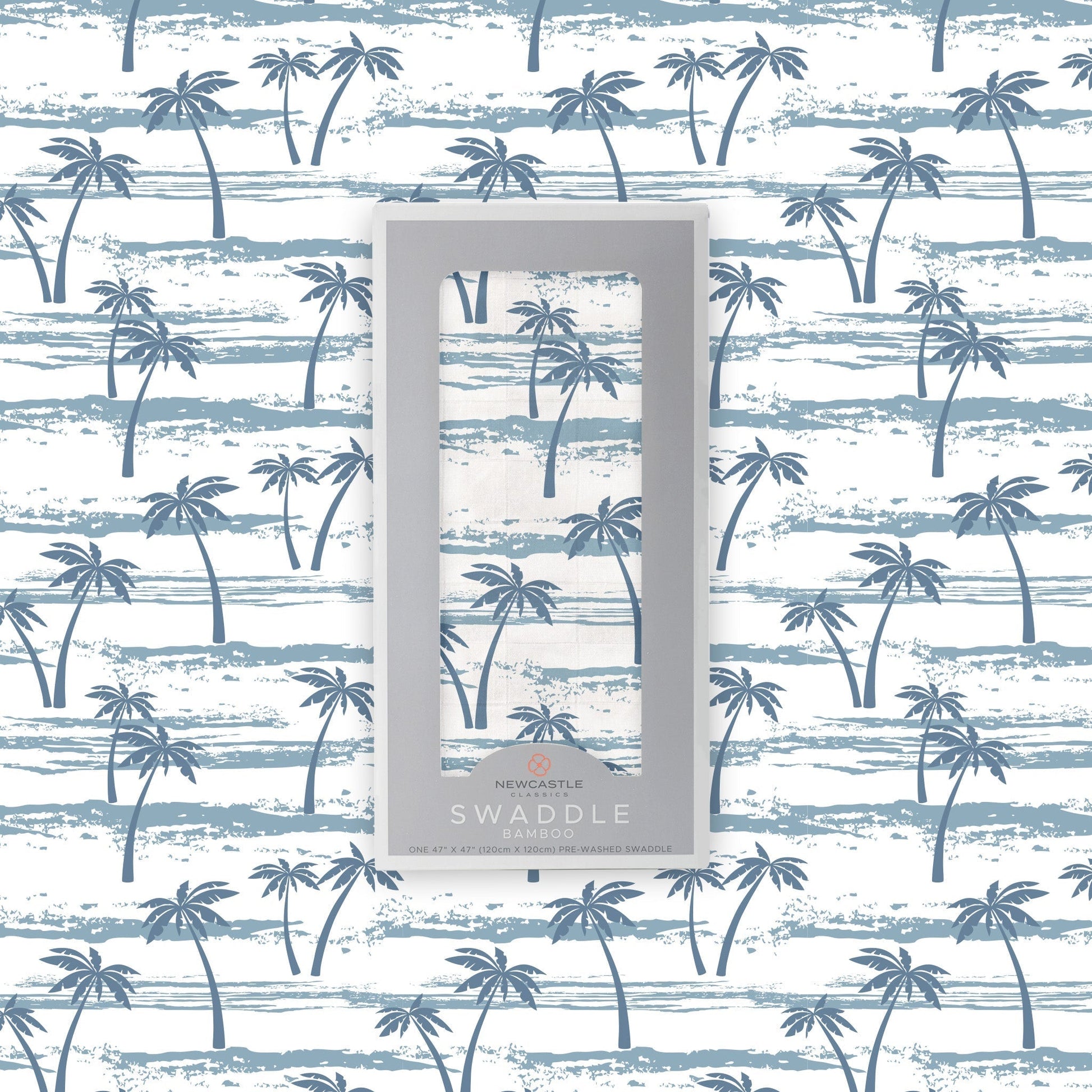 Flat lay of the Newcastle Classics Ocean Palm Trees bamboo muslin swaddle blanket shown with its branded grey packaging box in the center against a matching palm tree pattern background.