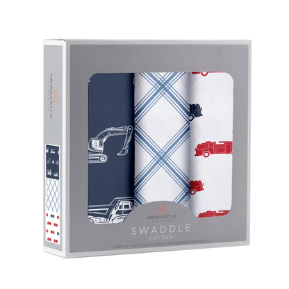 Angled front view of the Newcastle Classics 3-pack swaddle blanket set folded inside a grey window display box.