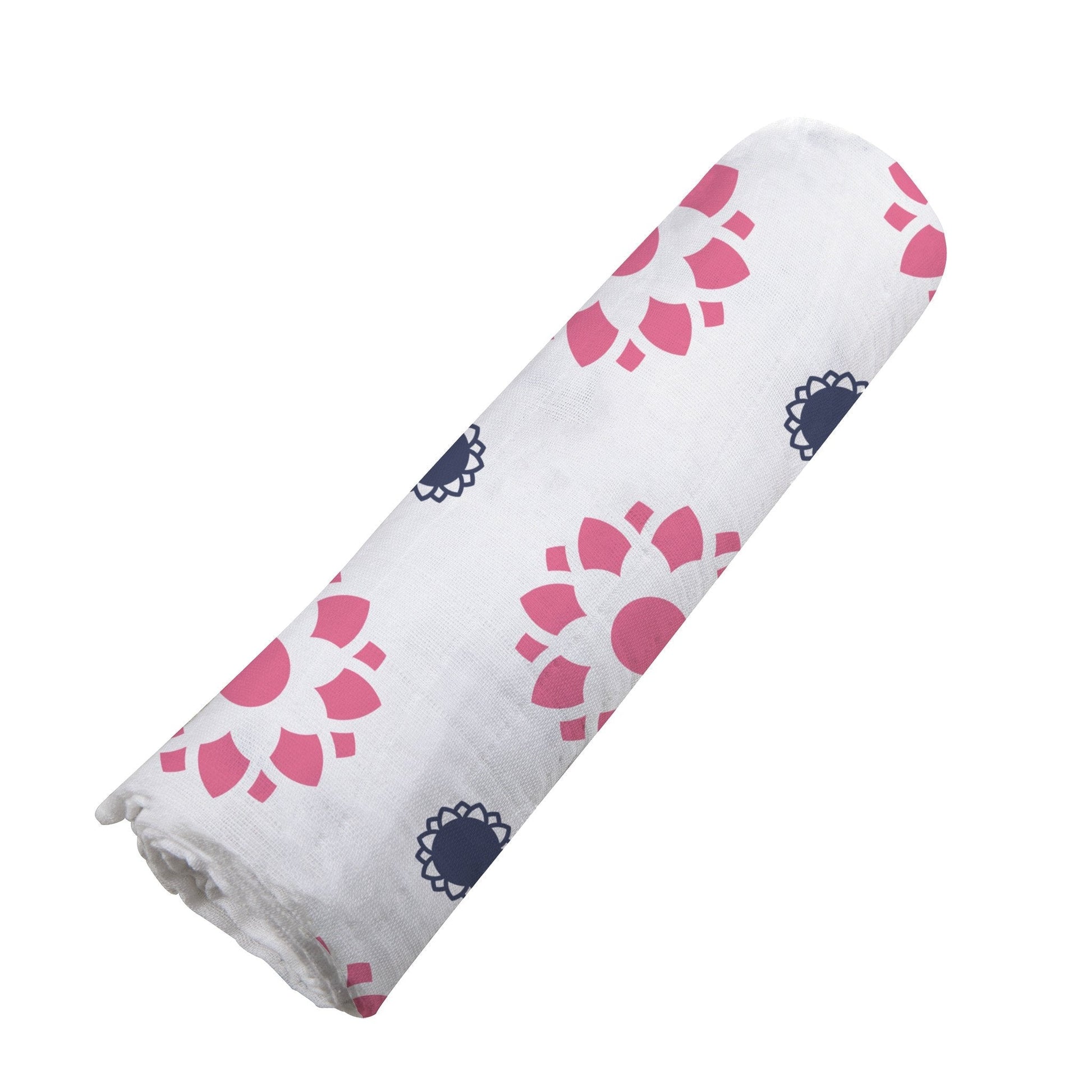 Angled view of the pink and indigo floral print cotton muslin swaddle blanket neatly rolled up.