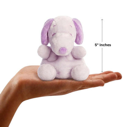 Dimension graphic showing the 5-inch Aurora Palm Pals Peanuts Purple Snoopy resting comfortably in a person's hand.