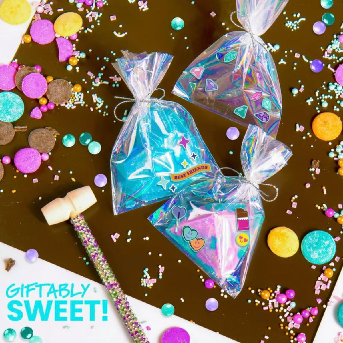 Colorful gift bags with decorative ribbons on a brown background with confetti.