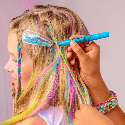 Person with colorful braided hair using a blue hair dye marker.
