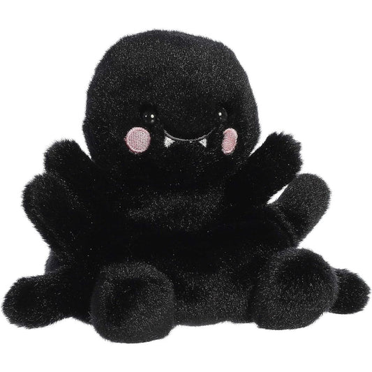 Aurora 5-inch Palm Pals Penny Mae Spider plush toy showing its jet-black fuzzy body, soft legs extending outwards, and cute face with tiny white fangs and pink cheeks.
