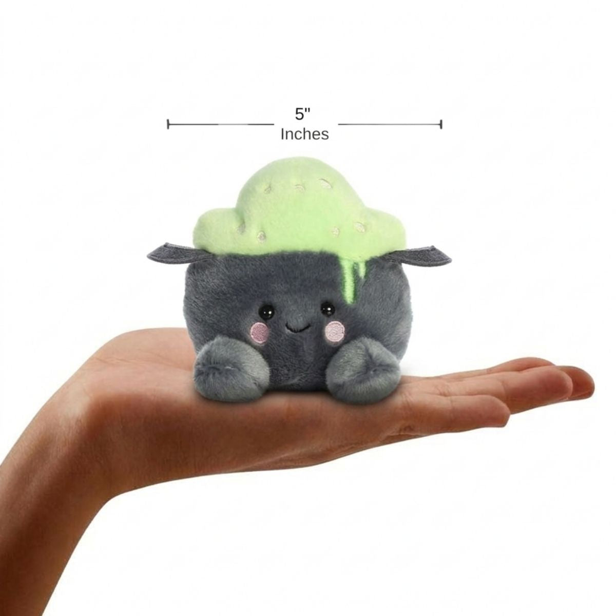 The miniature Bubbly Cauldron plush sitting balanced in an open human hand under a 5-inch width graphic indicator.