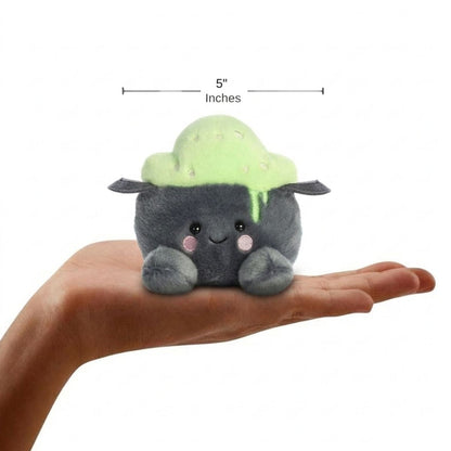 The miniature Bubbly Cauldron plush sitting balanced in an open human hand under a 5-inch width graphic indicator.