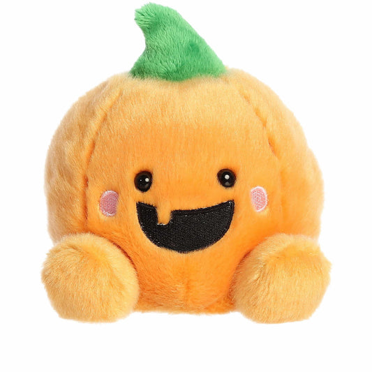 Plush pumpkin toy with a smiling face on a white background