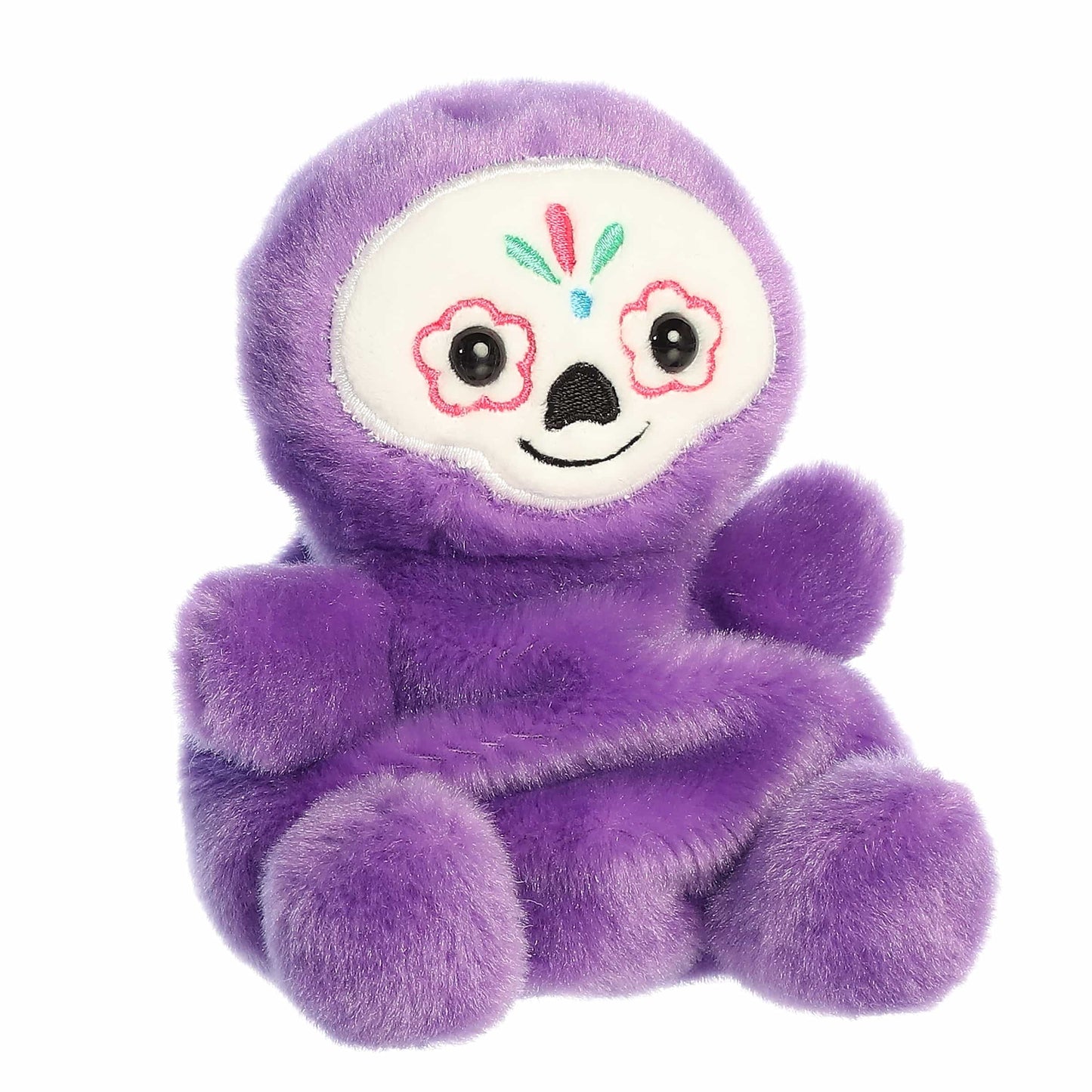 Aurora Palm Pals Sonia 5-inch Sugar Skull plush stuffed toy sitting forward with bright purple fur and a white embroidered calavera face.