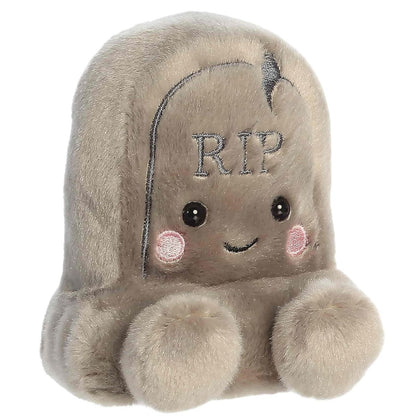 Aurora 5-inch Palm Pals Thom Tombstone plush toy sitting forward with soft stone-gray fur, an embroidered RIP sign, and a smiling face.