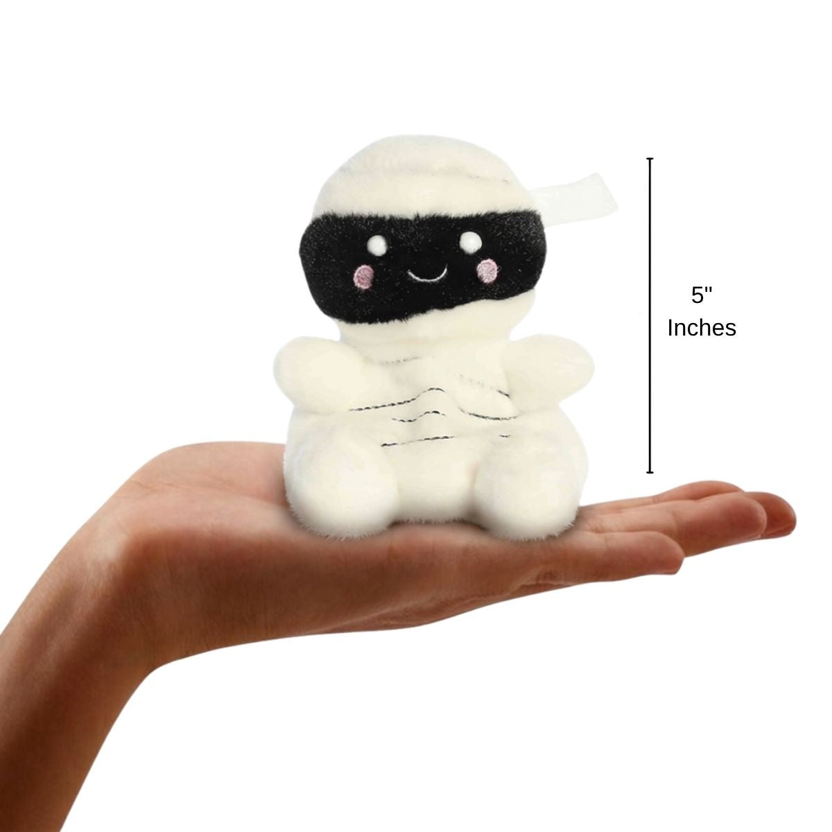 The miniature Wraphael Mummy plush balanced in an open human hand under a 5-inch height graphic indicator.