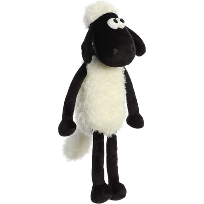 Front view of the Shaun the Sheep plush held upright, showcasing its full length, wide eyes, and floppy limbs.