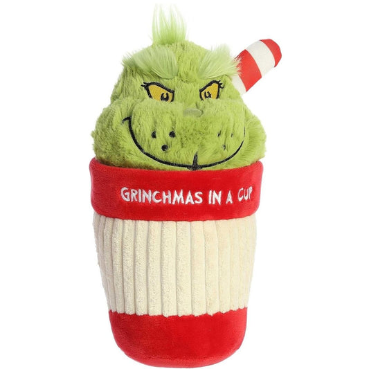 Slightly angled front view of the Grinch cup stuffed animal showing his classic grumpy smile and fluffy green hair.
