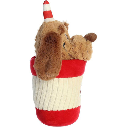 Side profile view of the Max holiday cup stuffed animal highlighting the ribbed texture of the plush cup and his floppy brown ears.