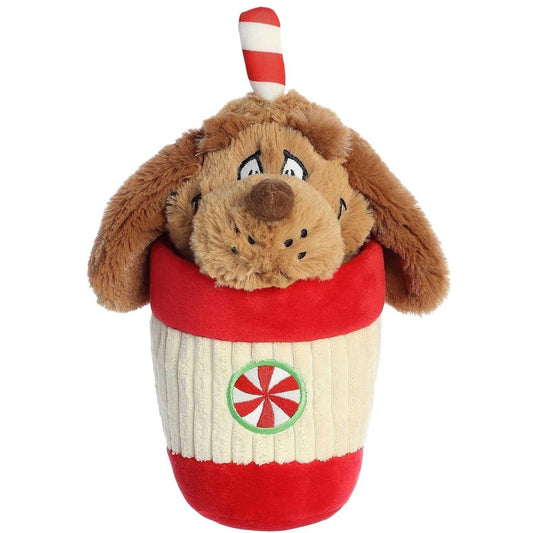 Front view of the 9-inch Aurora Dr. Seuss Max plush toy sitting inside a red and cream ribbed peppermint cup with his floppy ears hanging over the edge.