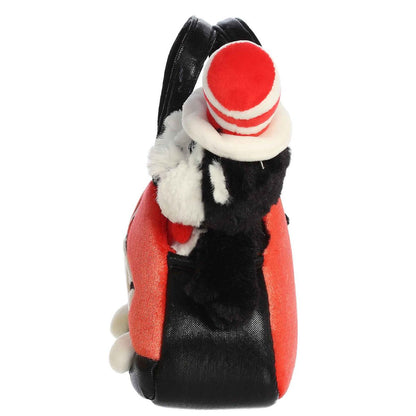 Side profile view of the Cat in the Hat plush resting securely inside the soft red and black carrying bag.