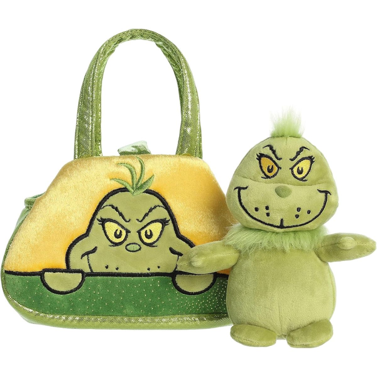 The green Grinch stuffed animal sitting right next to its empty yellow and green Fancy Pals carrying purse.