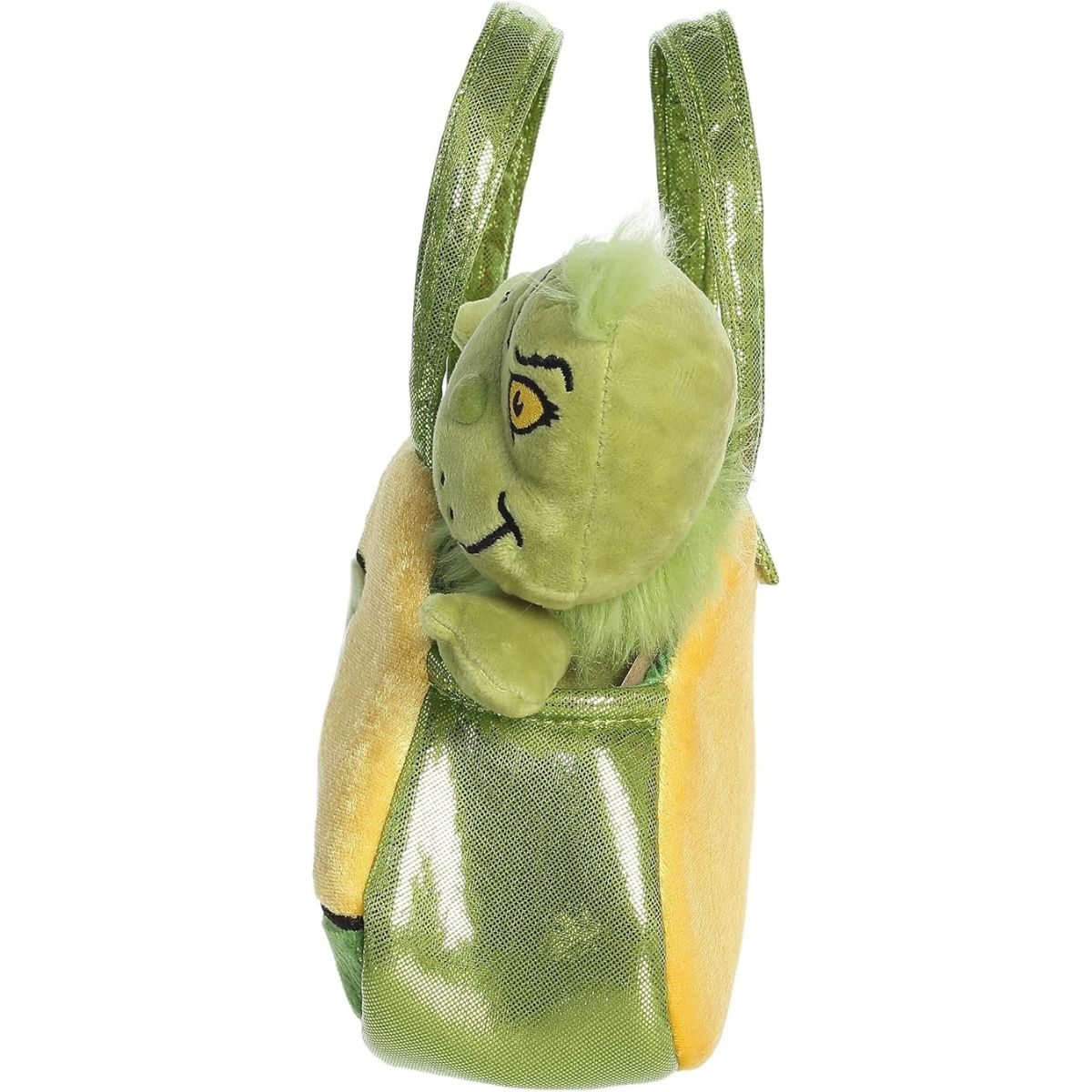Side profile view of the Grinch plush resting securely inside the soft green and yellow carrying bag.