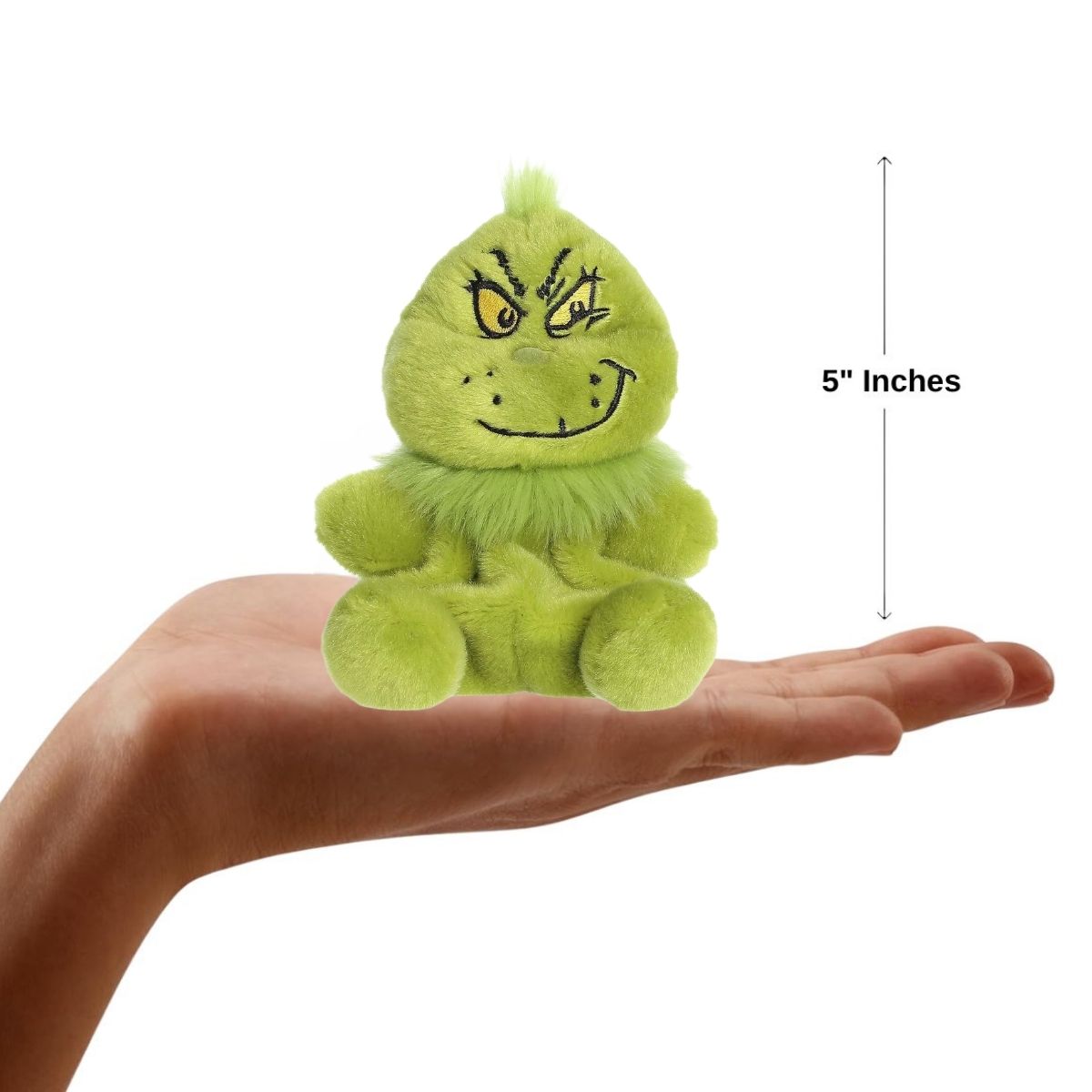 Sizing graphic for the Aurora Palm Pals The Grinch plush showing him sitting perfectly in the palm of a hand, indicating a total height of 5 inches.