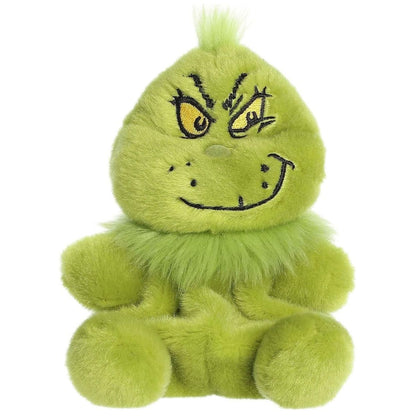 Front view of the Aurora Palm Pals 5-inch The Grinch Smirk plush sitting upright, showing his green fur, fluffy collar, and devious embroidered smile.