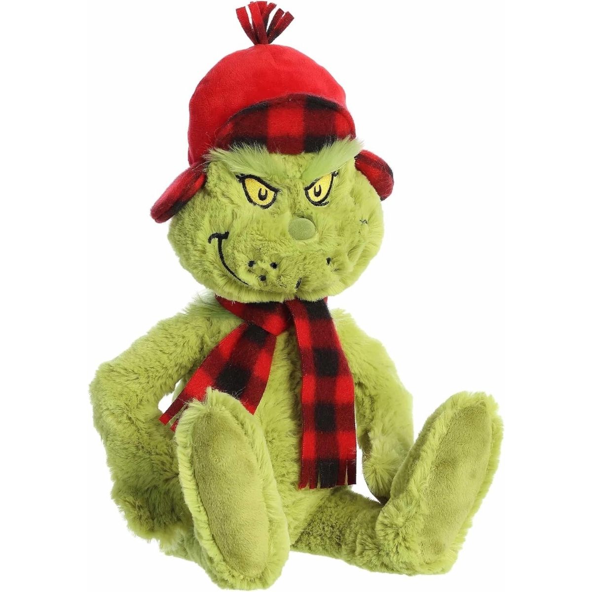The angled front view of the sitting Wilderness Grinch plush toy showing his soft green fur and cozy winter accessories.