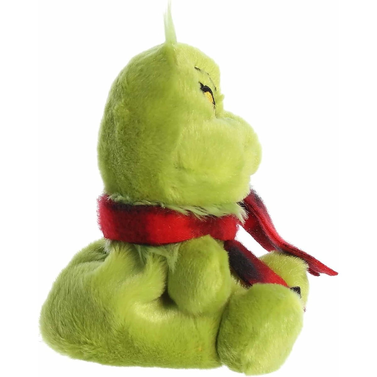 The right side profile view of the sitting Aurora Palm Pals Grinch plush showing his compact round shape.