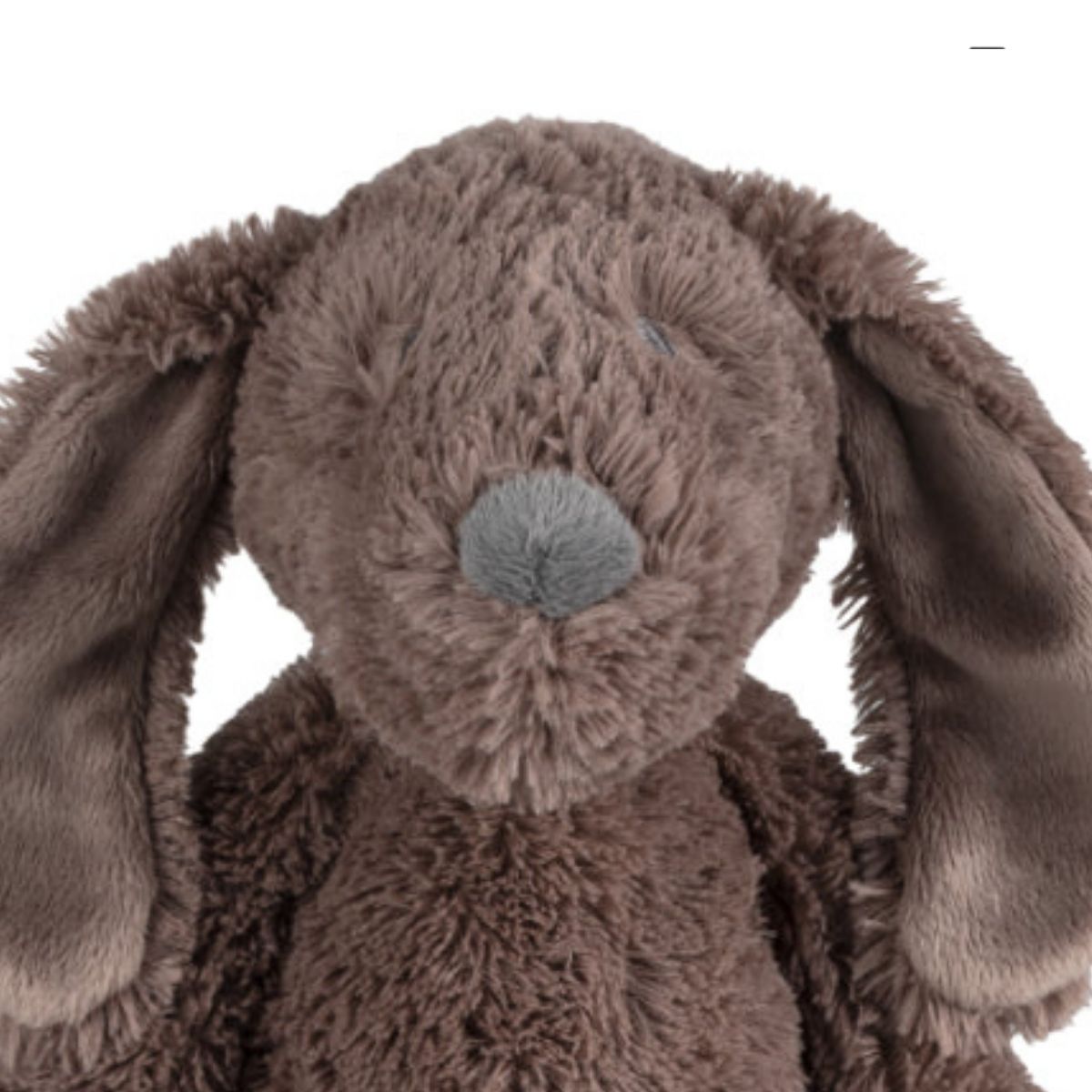 Close-up of the Happy Horse Dog Jax plush puppy highlighting its textured brown fur, long floppy ears, and soft grey nose.