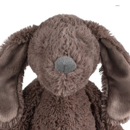 Close-up of the Happy Horse Dog Jax plush puppy highlighting its textured brown fur, long floppy ears, and soft grey nose.