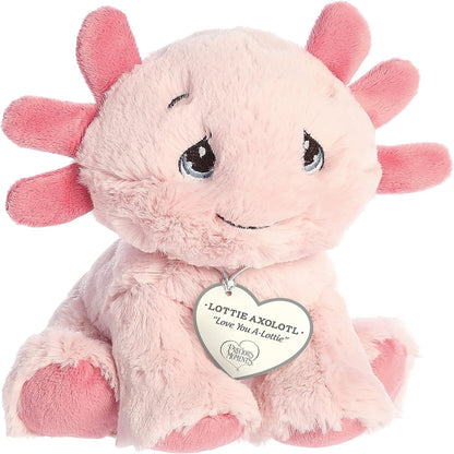 Front angled view of the 7-inch Aurora Precious Moments Lottie Axolotl plush toy featuring fluffy pink fur and a heart tag reading "Love You A-Lottie".