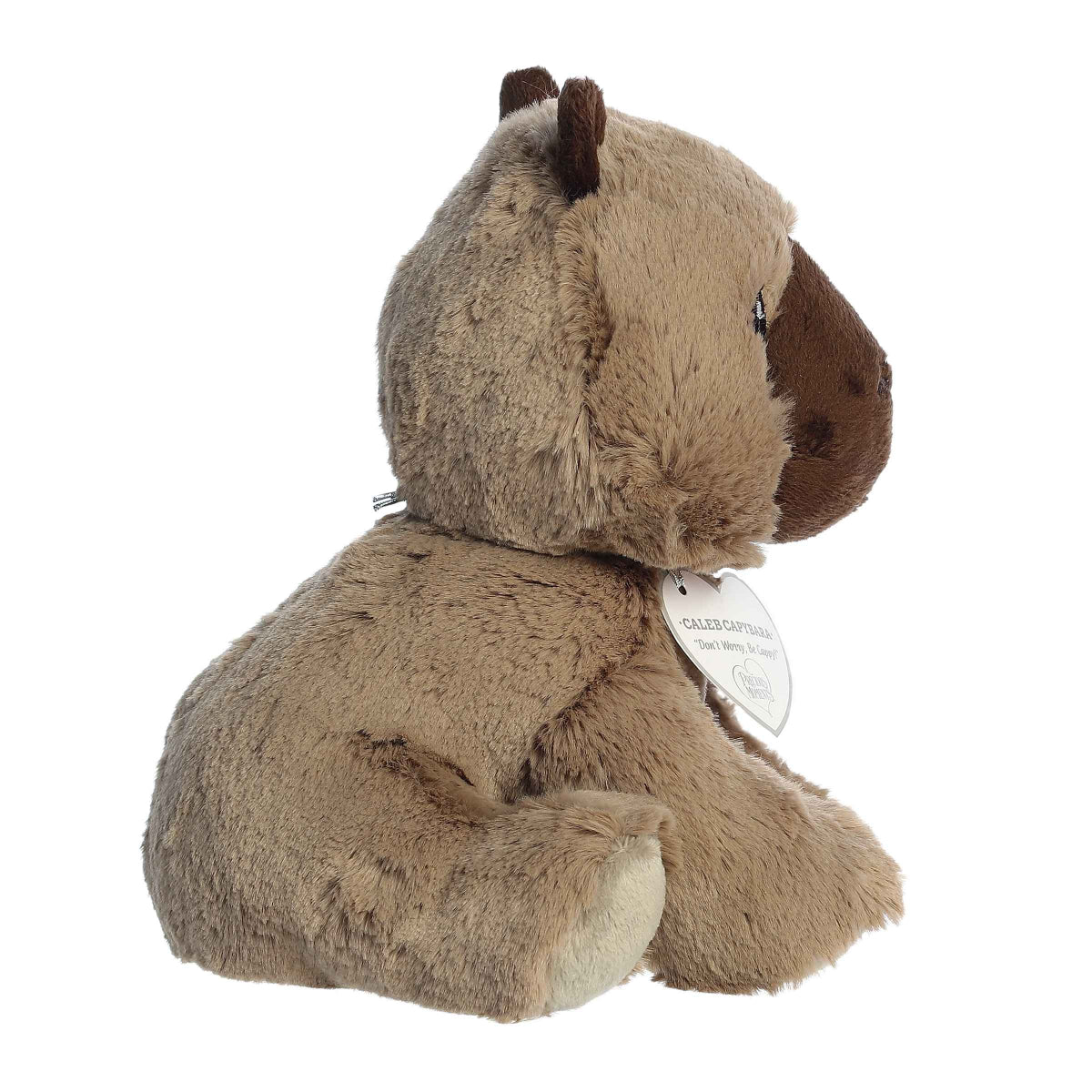 Side profile view of the Caleb Capybara highlighting its fluffy shape, little ears, and sitting pose.