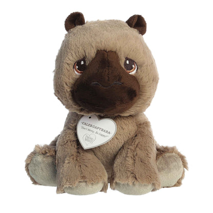 Straight front sitting view of the brown capybara plush showing its iconic Precious Moments teardrop eyes and dark brown snout.